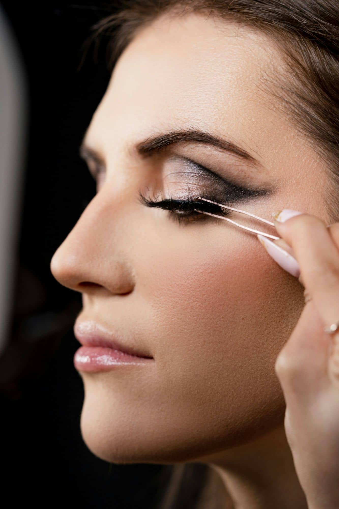 Profile of a model with a precise graphic eyeliner wing